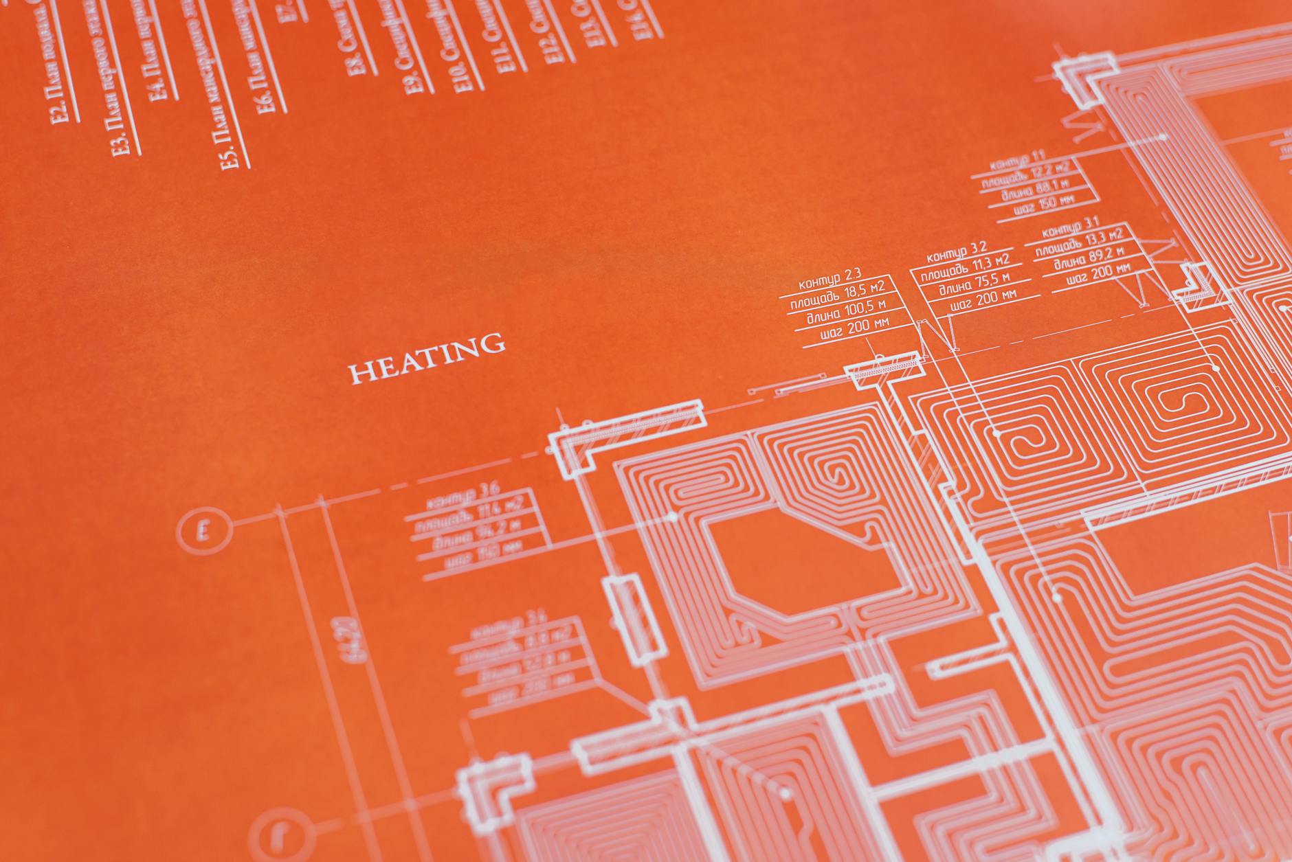 electrical certification documents on desk with blueprint background