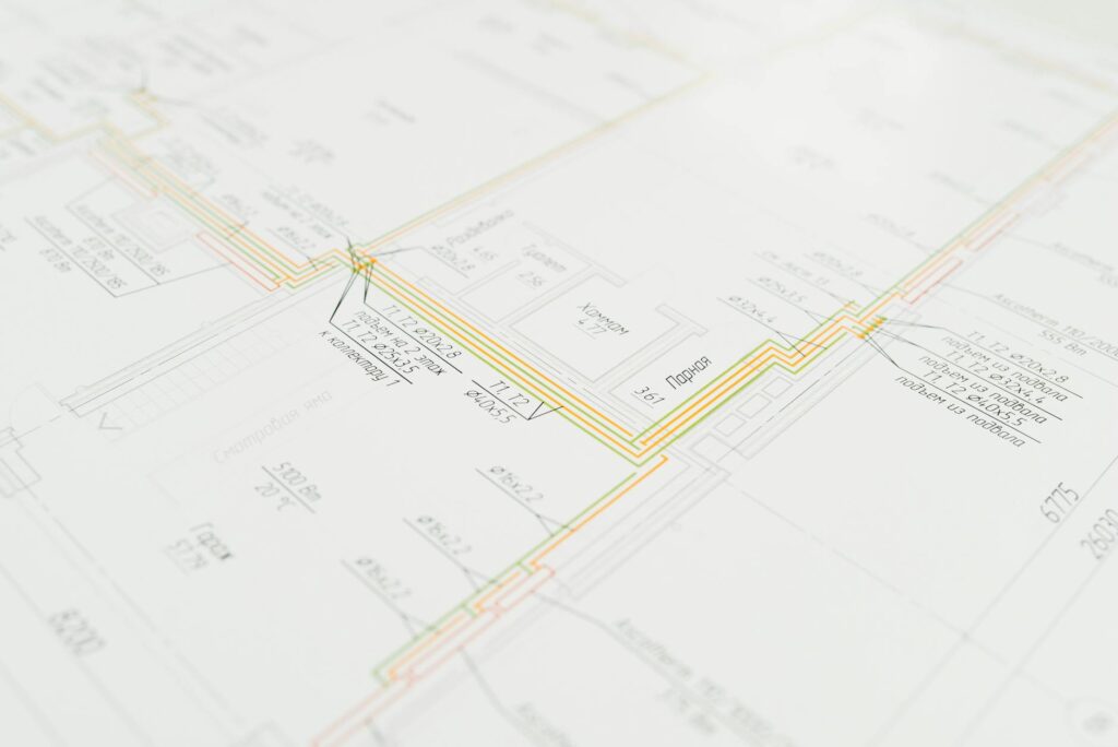 electrical inspection documents on desk with blueprint background