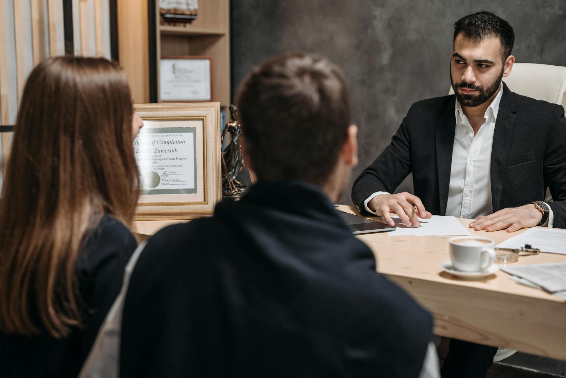 NIDI and SLO certification documents on desk