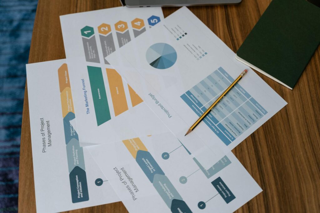 electrical certification documents and house wiring diagram on desk