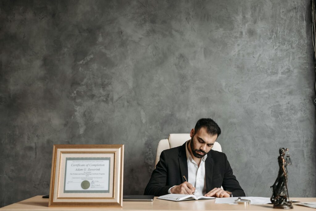 electrical certification paperwork and blueprint on desk