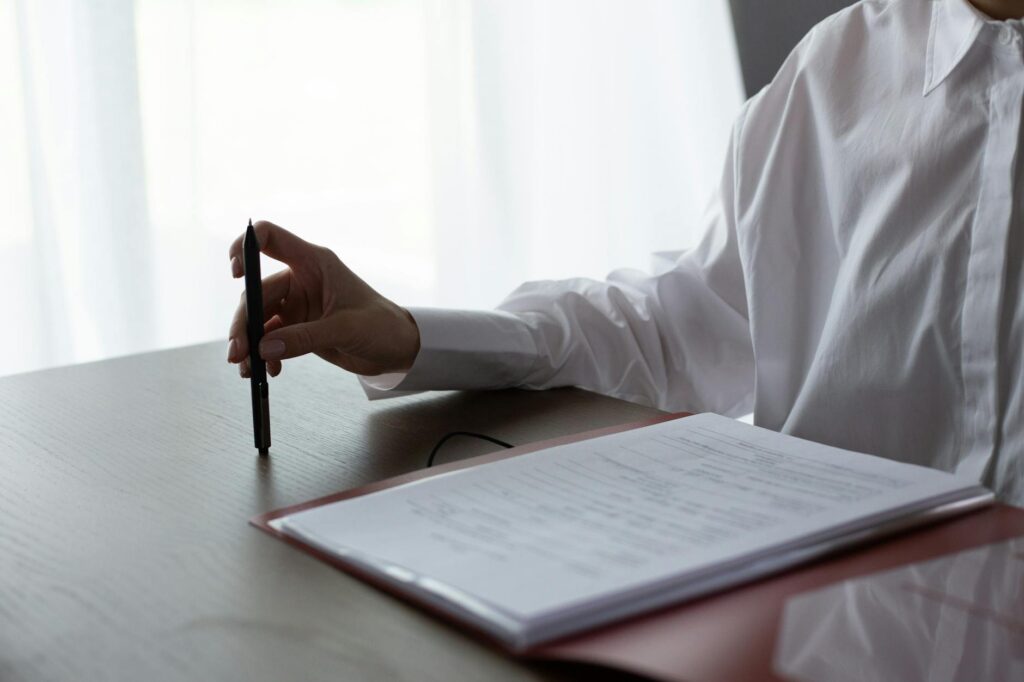 electrician reviewing certification documents on desk