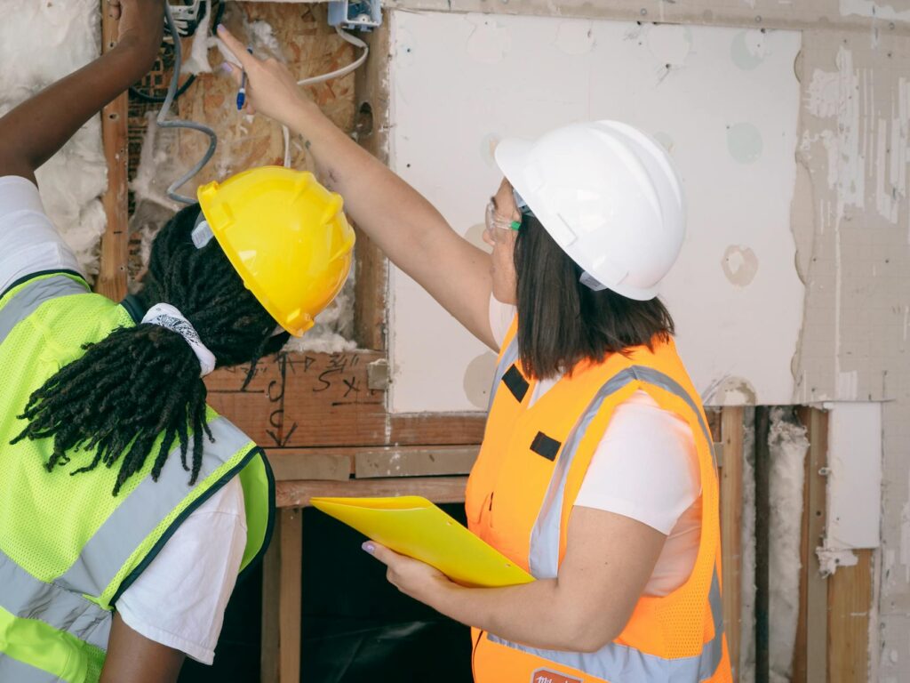 electrician inspecting overheating electrical panel