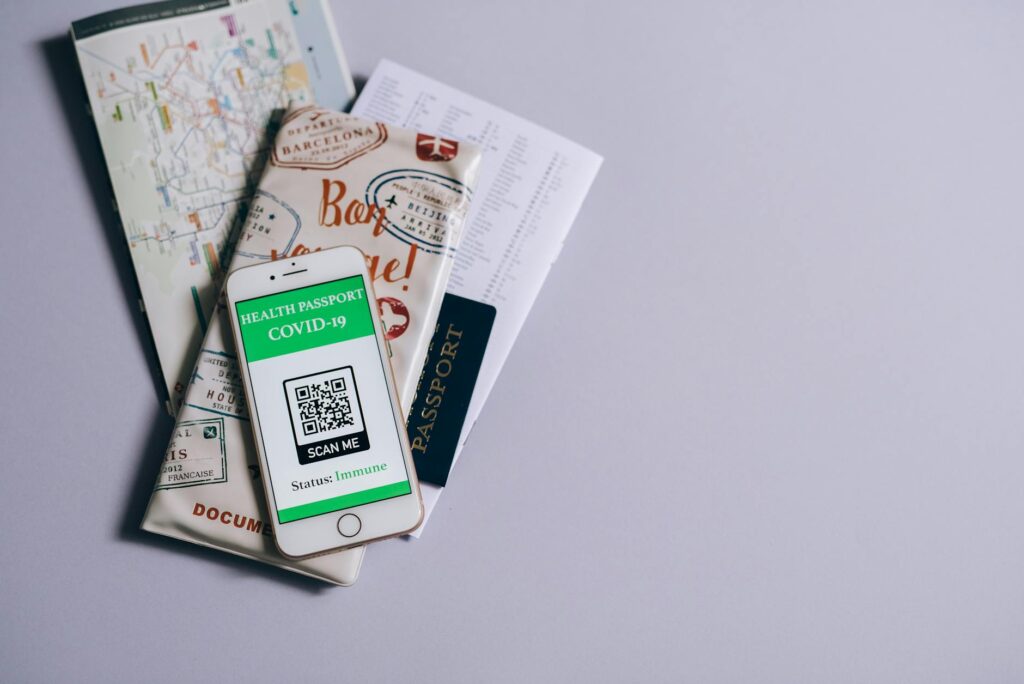 technician scanning electrical certificate with smartphone